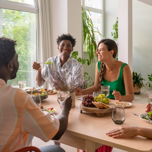 The essence of exceptional living Friends dining together